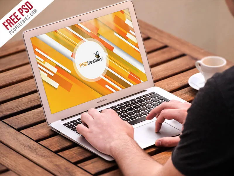 Man Working on Macbook Mockup PSD